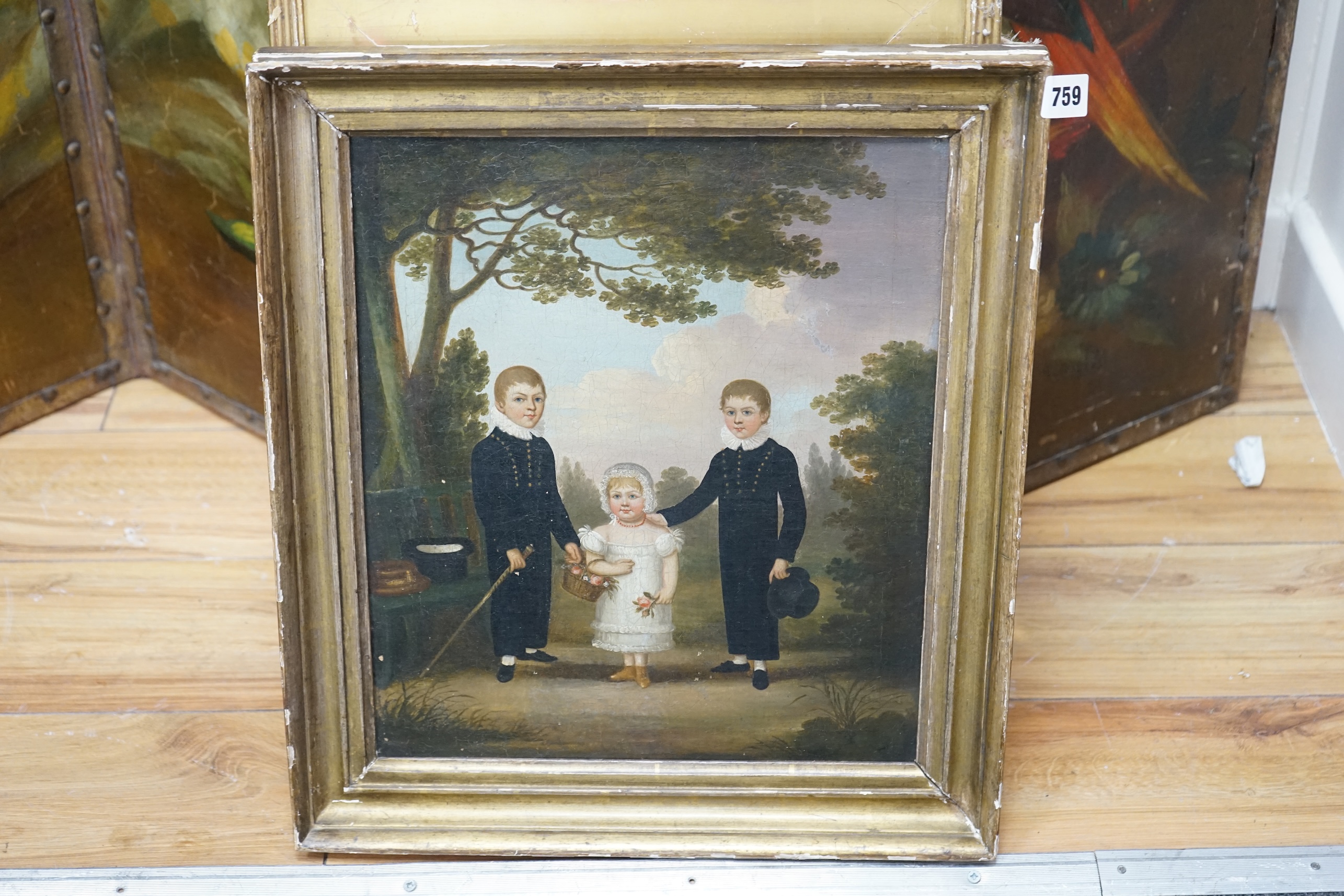 Early 19th century, English School, naive oil on canvas, Three children before a landscape, 38 x 32cm. Condition - fair, craquelure throughout